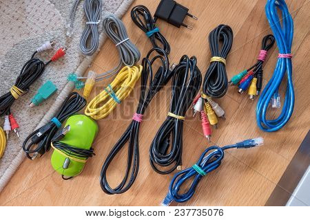 Wires, Cords And Cables Bonded With An Elastic Band On The Floor