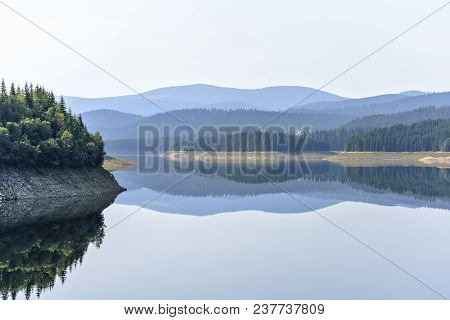 Daylight Misty View To Oasa Dam Lake With Mountains