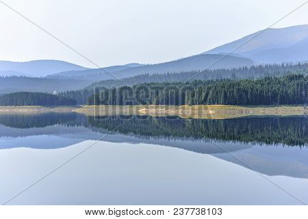 Daylight Misty View To Oasa Dam Lake With Mountains