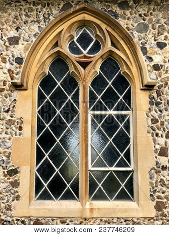 Exterior church stone, glass and metal lattice window