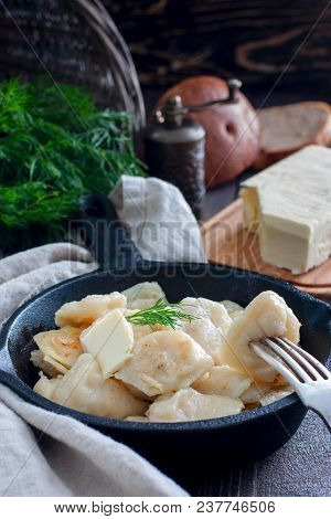 Fried Dumplings With Cabbage In A Portioned Cast-iron Frying Pan, Selective Focus
