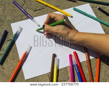 White Sheet Of Paper With Markers. View From Above