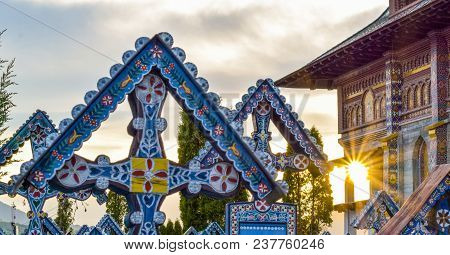 Sunset Over Merry Cemetery In Sapanta, Maramures, Romania. This Is Most Popular Tourist Sites In Rom
