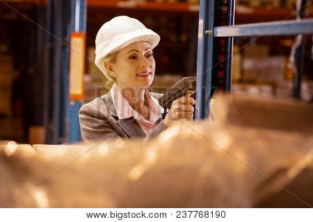 Storehouse Inventory. Joyful Delighted Woman Scanning Goods While Checking The Storehouse Inventory