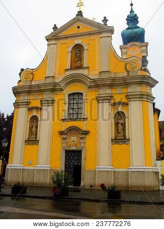 Facade Of The Carmelite Church In Gyor (hungary) From The Front In A Summer Rainy Day. Undistinguish