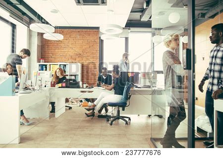 Young Multy Ethnic People Working In Different Ways In The Light Office.
