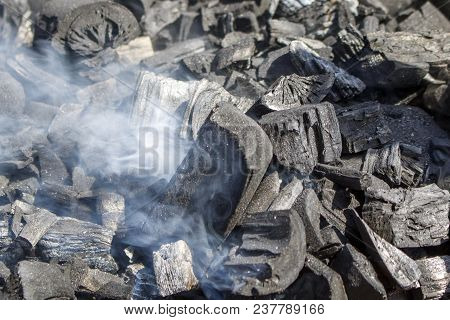 Smoldering In The Fire Of Coals And Smoke