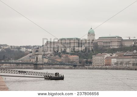 Budapest, Hungary - April 7, 2018: Buda Castle Seen From Pest With The Danube In Front.  The Castle 