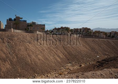 Suburb Of Eilat City In The Desert  In The Israil In Sunny Day With Blue Sky And Rubish