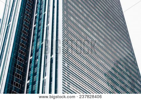 Astana, Kazakhstan - April 26, 2018: Details Of The Facade Of A Modern Skyscraper Made Of Glass And 