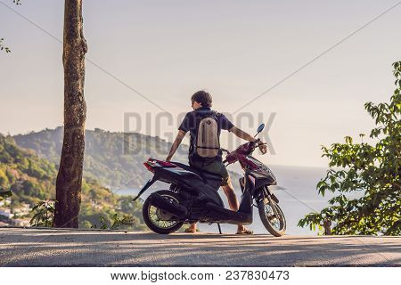 A Man On A Motorbike Against The Sea.