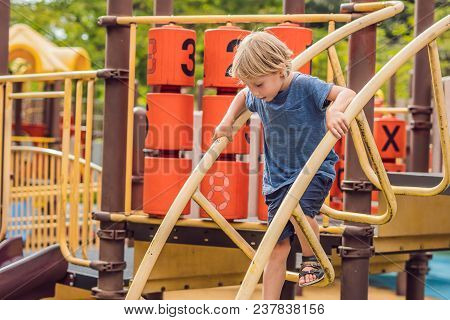 Funny Cute Happy Baby Playing On The Playground. The Emotion Of Happiness, Fun, Joy.
