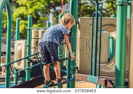 Funny Cute Happy Baby Playing On The Playground. The Emotion Of Happiness, Fun, Joy.