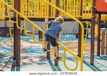 Funny Cute Happy Baby Playing On The Playground. The Emotion Of Happiness, Fun, Joy.