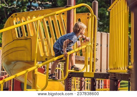 Funny Cute Happy Baby Playing On The Playground. The Emotion Of Happiness, Fun, Joy.