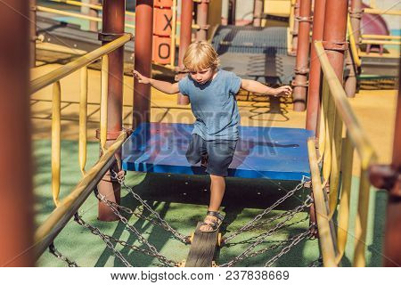 Funny Cute Happy Baby Playing On The Playground. The Emotion Of Happiness, Fun, Joy.