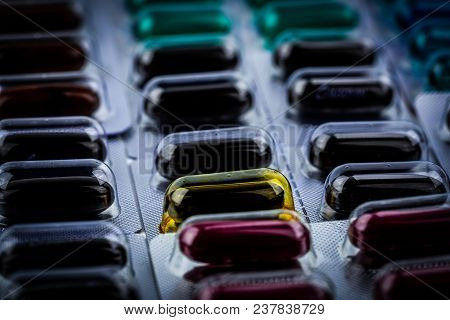 Closeup Of Vitamins And Supplements Capsule Pills In Blister Packaging. Pharmaceutical Industry Conc