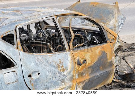 An abandoned, stolen burnt out car