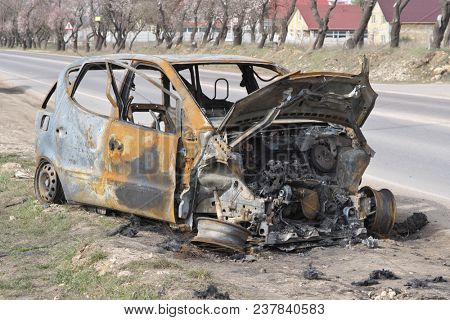 An abandoned, stolen burnt out car