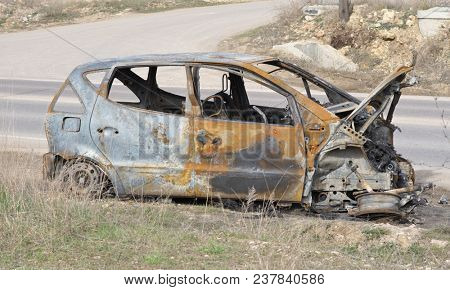 An abandoned, stolen burnt out car