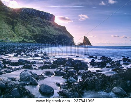 Rocky Coast Of Sea. Slow Shutter Speed For Smooth Water Level. Visite Talisker Bay On The Isle Of Sk