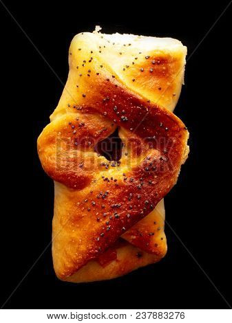 Buns With Raisins And Jam On A Black Background .