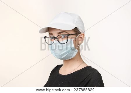 Girl In Medical Mask With Respirator On White Background.