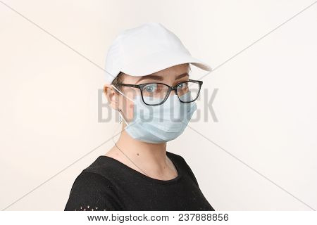 Girl In Medical Mask With Respirator On White Background.