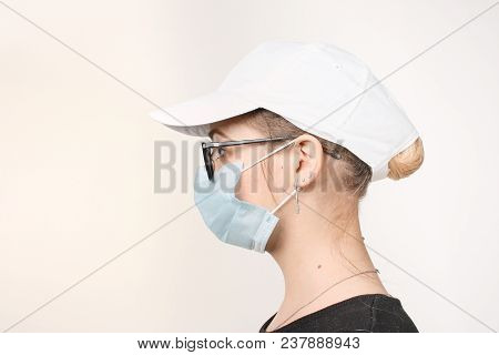 Girl In Medical Mask With Respirator On White Background.