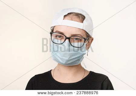 Girl In Medical Mask With Respirator On White Background.
