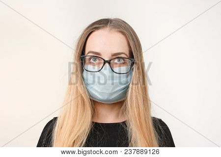 Girl In Medical Mask With Respirator On White Background.