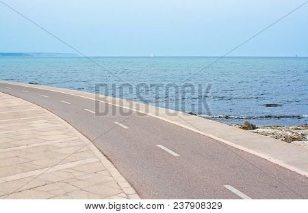 Curved Biking Track Near Mediterranean Sea On An Overcast Day In Molinar, Mallorca, Spain.
