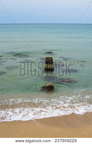 Old Stone Pier In The Green Water In Mallorca, Spain