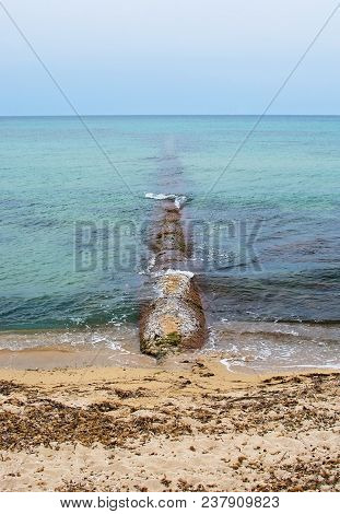Old Stone Pier In The Green Water In Mallorca, Spain