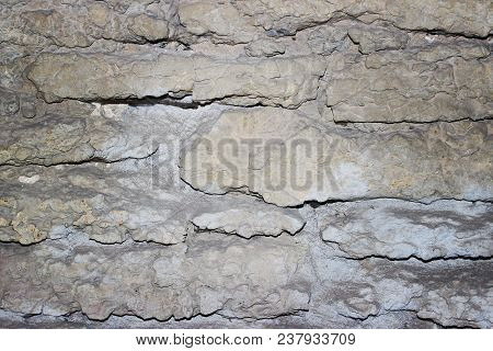 Stone Wall Of Old Masonry Close-up. Background And Texture.