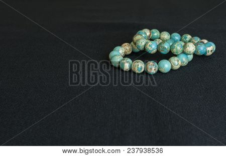 Variscite Round Bead Stretchy Bangle Bracelet On Black Thai Fabric Background