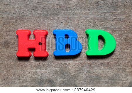 Color Alphabet In Word Hbd (abbreviation Of Happy Birthday) On Wood Background