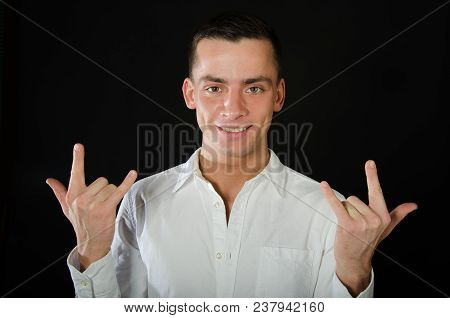 Young Handsome Guy Is Fooling Around. Emotional And Funny. Finger Gesture