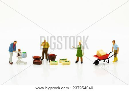 Miniature People : Spending Cash For Shopping In The Market. Image Use For Marketing, Merchant Middl