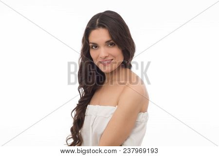 Beautiful Brunette Model In White Dress Mking Studio Shooting. Isolated On White Background. Mid Age