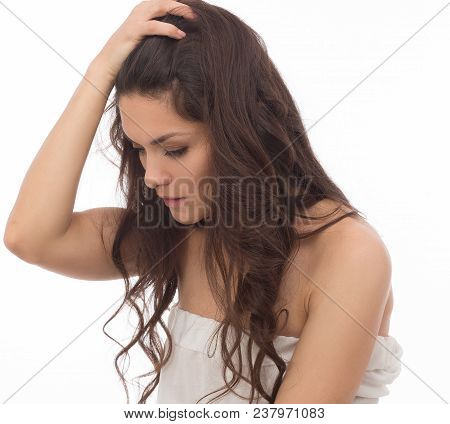 Close Up Portrait Of Beautiful Brunette Sitting Half Turn. Looking Disappointed. Mid Age Woman Over 