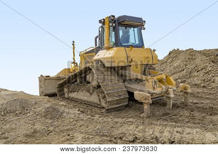 Yellow Bulldozer At A Loamy Construction Site