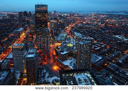 The Boston, Massachusetts Skyline At Dusk With Traffic