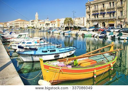 Sete, France - March, 12, 2015: Fisherman Boats And The Consular Palace At The Royal Channel In Sete