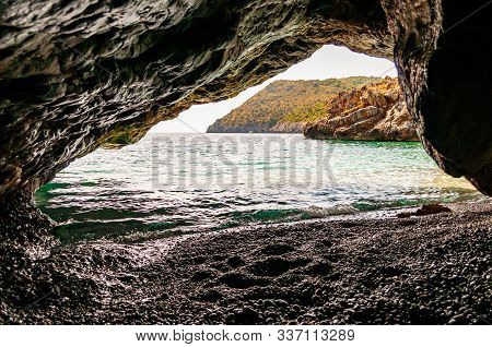Amazing Seascape View From Unique Sea Cave Overhanging Above Water On Famous Cala Bianca Beach Sceni