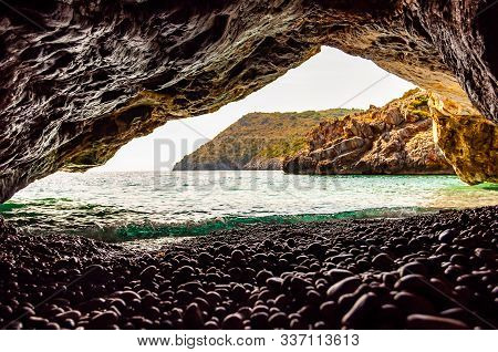 Amazing Seascape View From Unique Sea Cave Overhanging Above Water On Famous Cala Bianca Beach Sceni