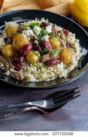 Greek Lamb Stew Marinated In A White Wine Salmoriglio Sauce With New Potatoes Kalamata Olives Feta C