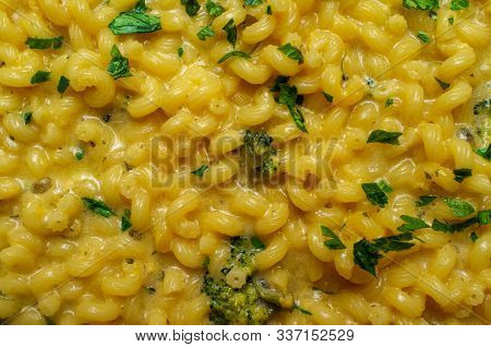 Delicious Macaroni And Cheddar Cheese Cellentani Pasta Cooking On Kitchen Stove