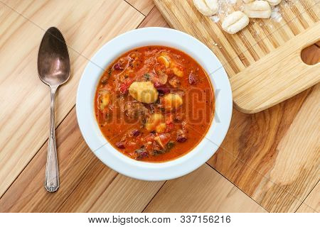 Italian Cuisine Sausage Gnocchi Soup With Tomato Basil Broth