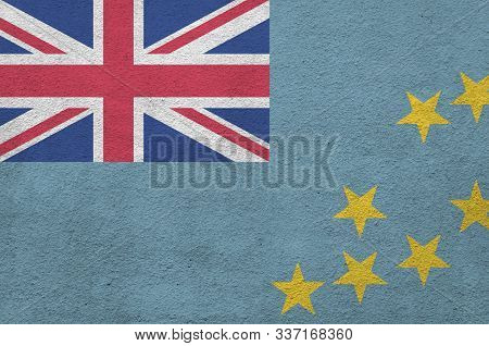 Tuvalu Flag Depicted In Bright Paint Colors On Old Relief Plastering Wall. Textured Banner On Rough 